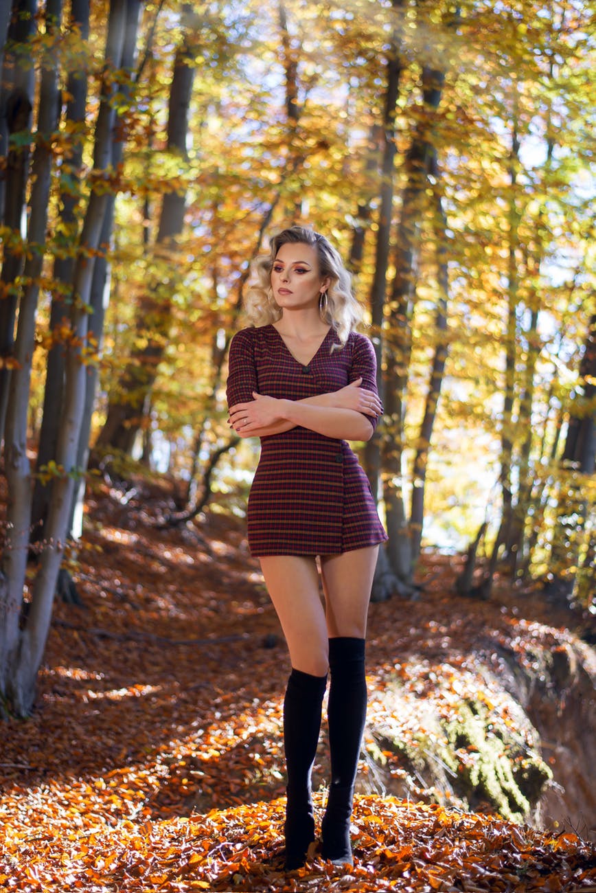 woman standing near trees