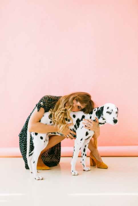 woman hugging dalmatian