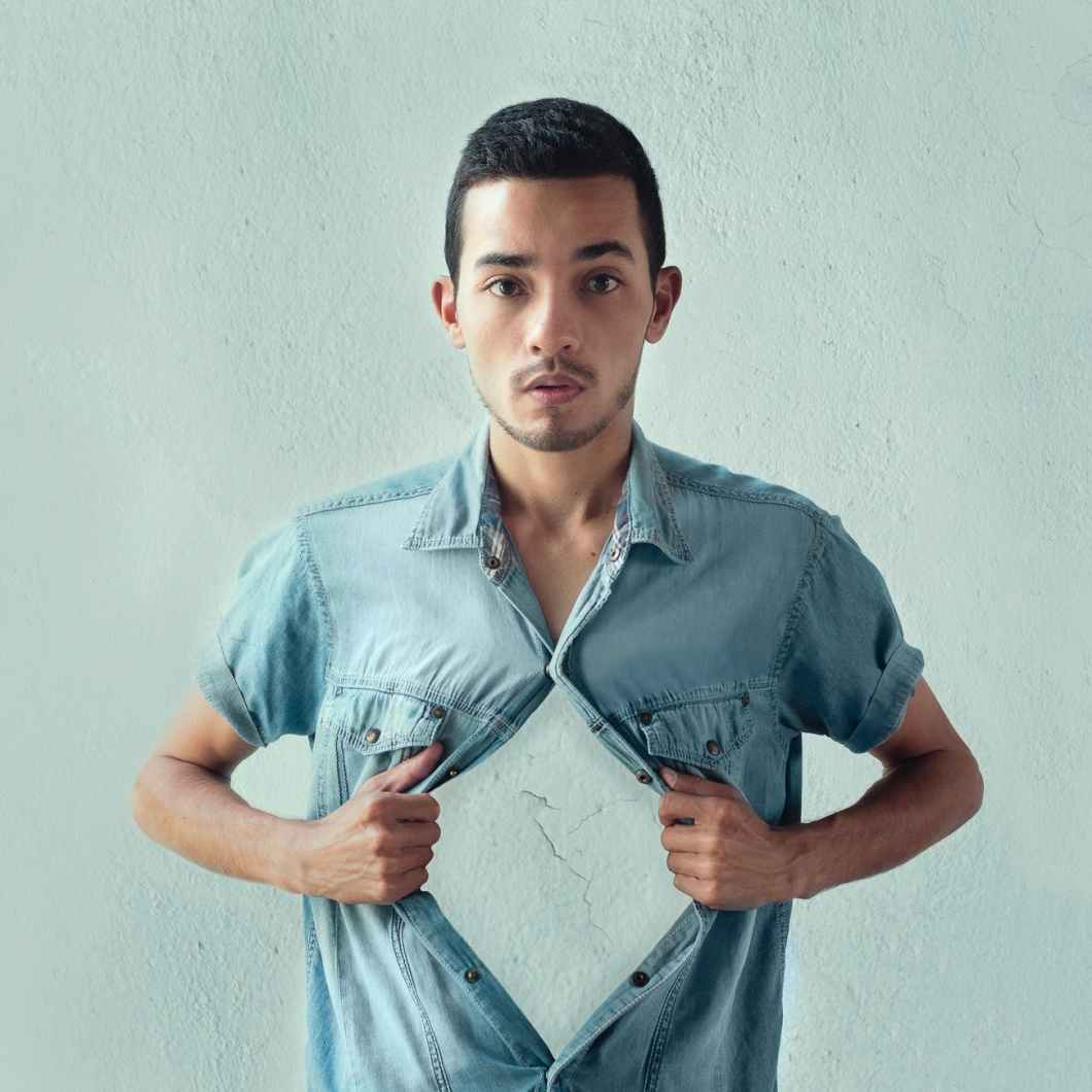 man wearing blue denim dress shirt