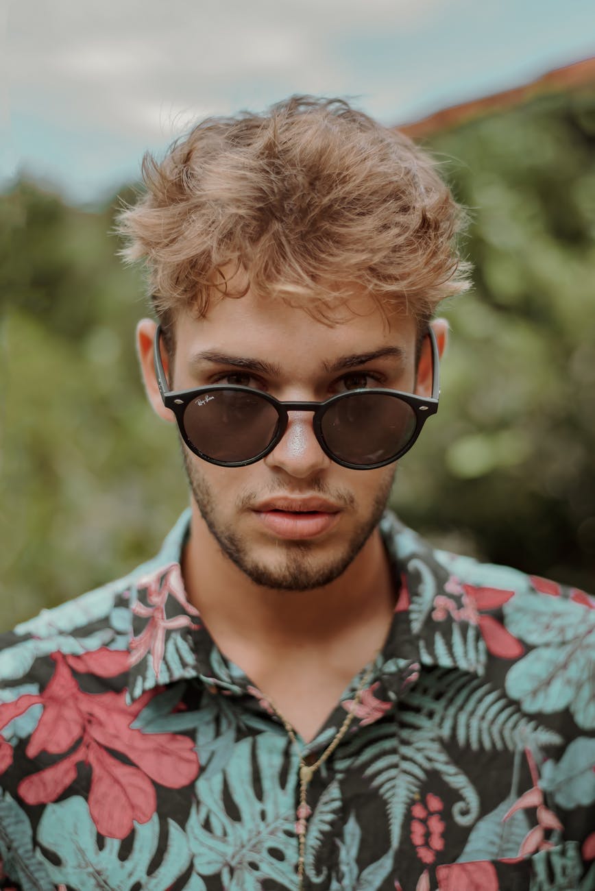man in floral collared shirt